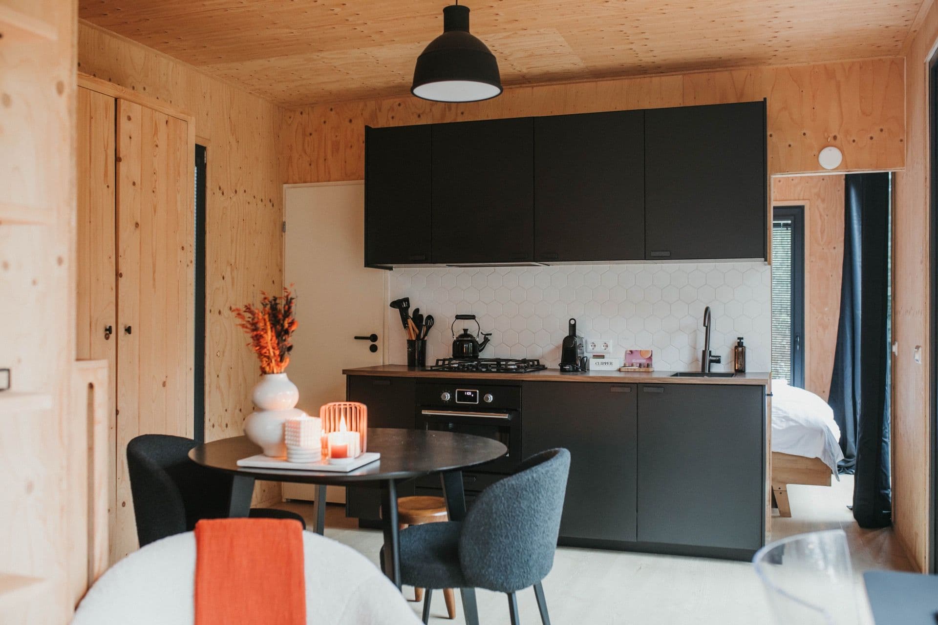 Fully equipped kitchen with dining table at MIYO Nunspeet